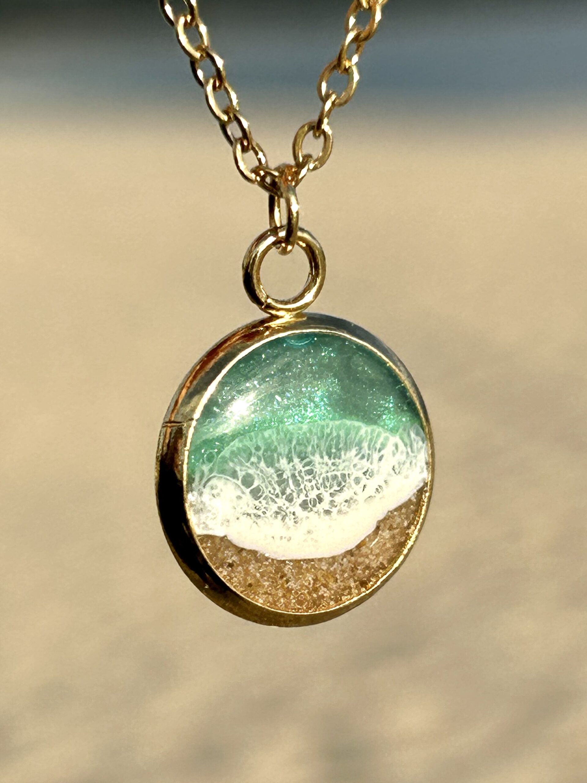 Colgante dorado “Lances”